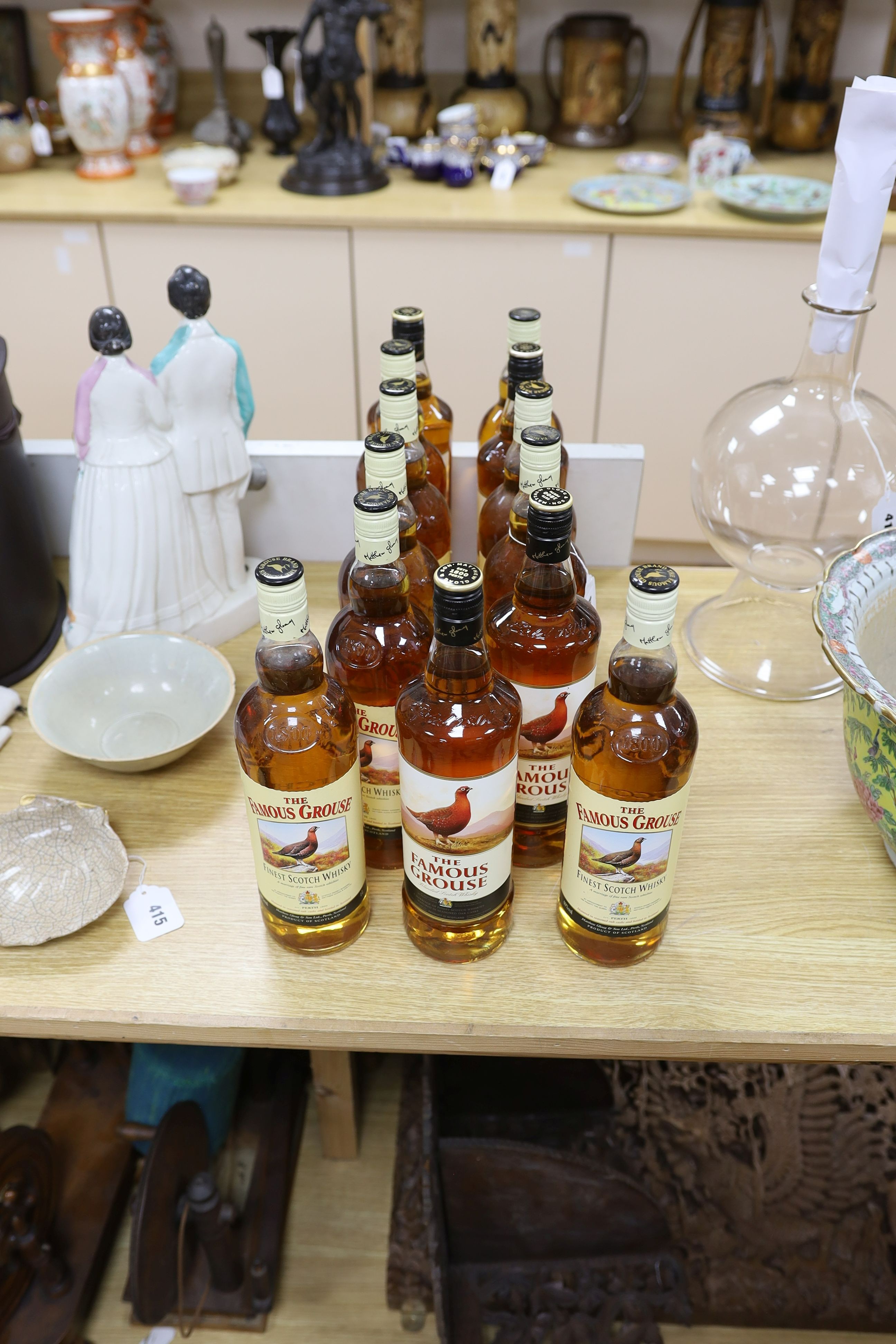 Thirteen single litre bottles of The Famous Grouse scotch whisky